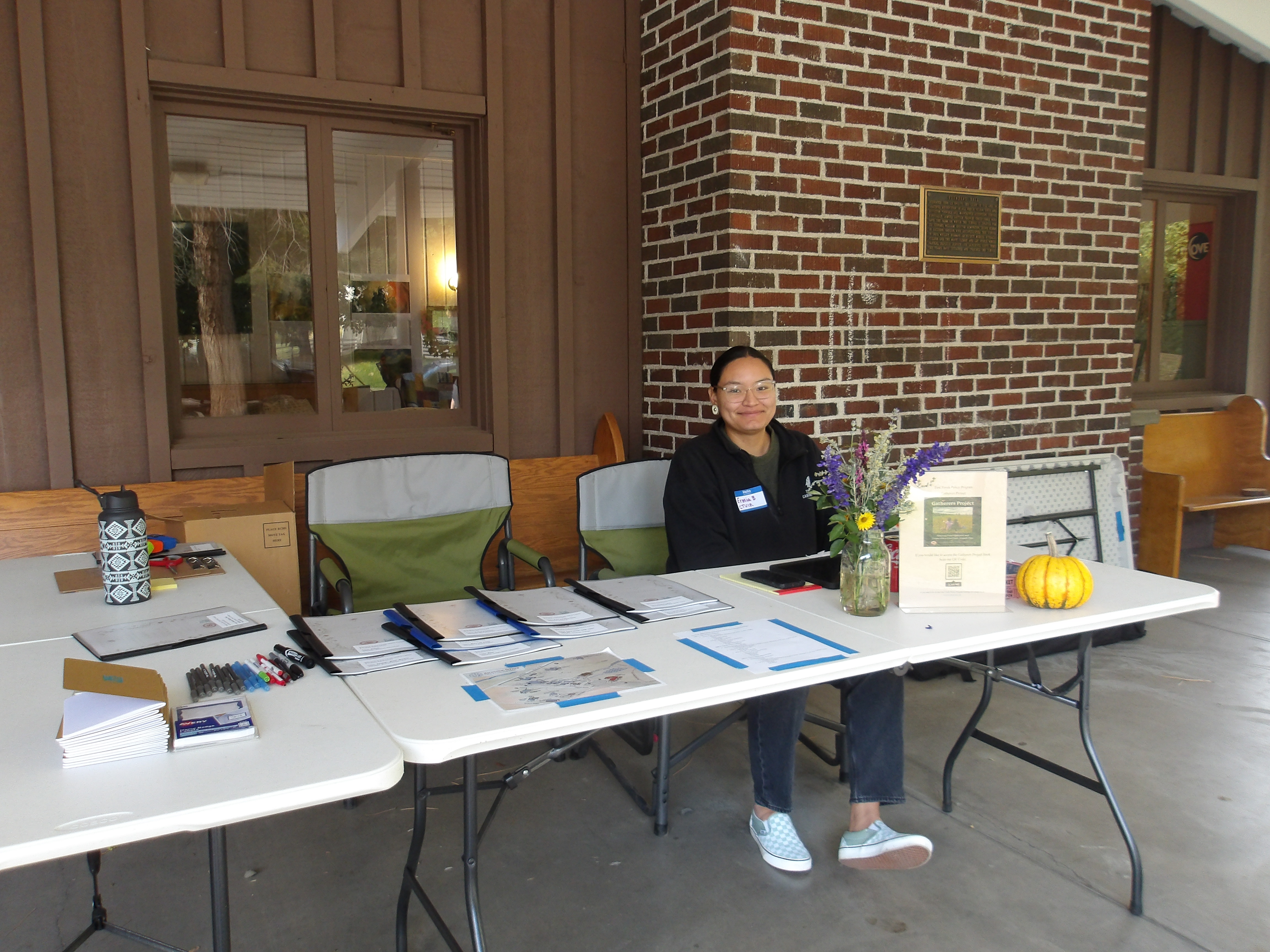 Symposium attendees checked into the event at the welcome table ouside Founders Hall; thank you to First Foods Policy Program's Ermia Butler and Althea Huesties-Wolf for staffing the table and making everyone feel welcome! Photo Credit: CTUIR DNR FFPP 2025